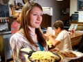 Jessie Spaulding serves food at Shooters in Rifle.